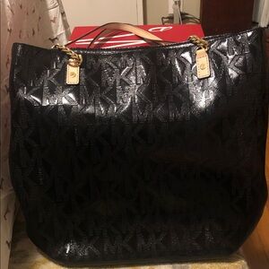 Michael Kors Black Logo Patent Tote with Gold Chain Accents.  Gently used.